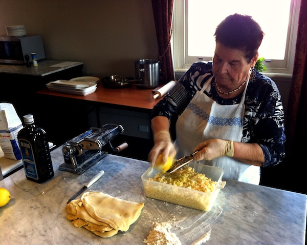 Sabine hard at work grating mozzarella 
