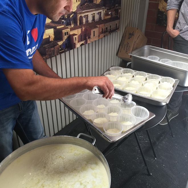 Mister Bianco adding curds and whey to punnets