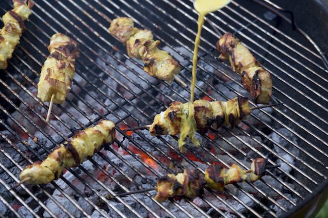 Thai BBQ Pork recipe skewers with sauce drizzle
